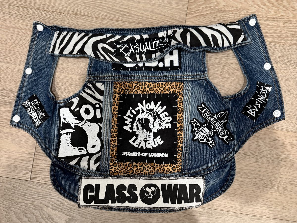 The Chloe Oi! vest laid flat: an Anti-Nowhere League Streets of London back patch on leopard print, an Oi! boot patch on zebra print, a zebra-print collar with a Casualties strip, G.B.H, Cockney Rejects, The Business and Angelic Upstarts patches, and a Class War strip across the hem